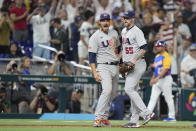 United States third baseman Nolan Arenado, left, and pitcher Ryan Pressly (55) celebrate after the U.S. beat Venezuela 9-7 in a World Baseball Classic game, Saturday, March 18, 2023, in Miami. (AP Photo/Wilfredo Lee)