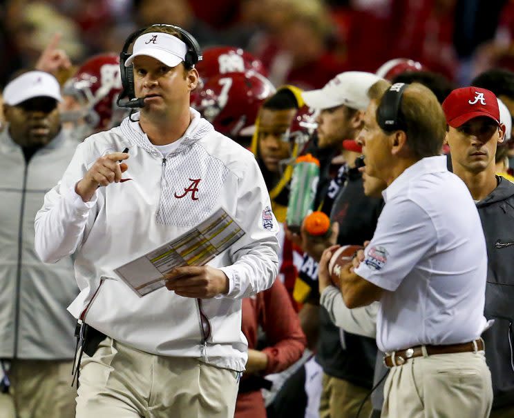 Alabama offensive coordinator Lane Kiffin makes a play call as head coach Nick Saban watches during the first half of the Peach Bowl NCAA college football game, Saturday, Dec. 31, 2016, in Atlanta. (AP Photo/Butch Dill)