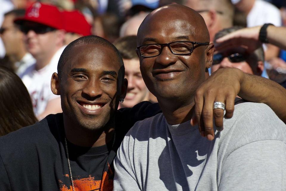 <p>John W. McDonough /Sports Illustrated via Getty</p> obe Bryant with his father Joe Bryant during Los Angeles Angels of Anaheim vs Los Angeles Dodgers game