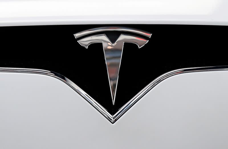 FILE PHOTO: FILE PHOTO: FILE PHOTO: The Tesla logo is seen on a car at Tesla's showroom in Manhattan's Meatpacking District in New York