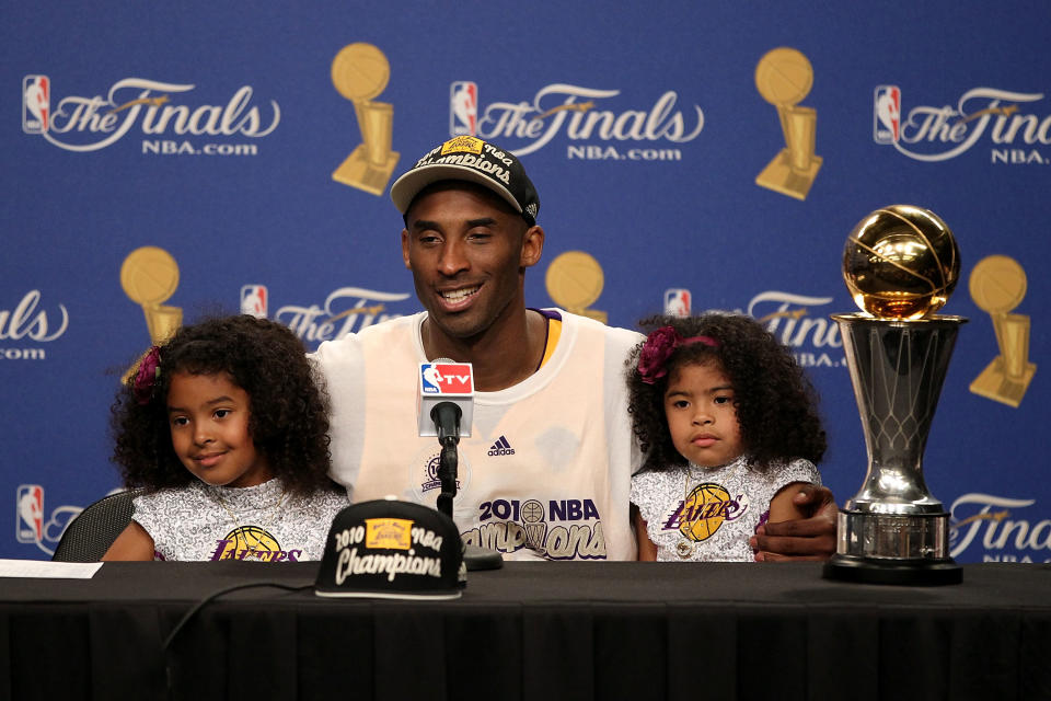 Kobe Bryant speaks during the post game news conference with daughters Natalia and Gianna Bryant after winning Game Seven of the 2010 NBA Finals at Staples Center on June 17, 2010 in Los Angeles, (Photo by Christian Petersen/Getty Images)