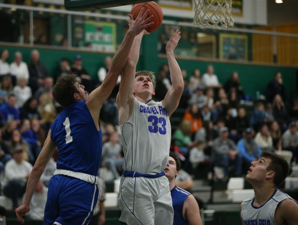 Chapel Field's Jonah McDuffie takes a layup against Roscoe's Anthony Teipelke during the Section 9 Class D boys basketball final at SUNY Sullivan on March 1, 2023. 