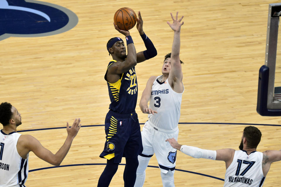 Indiana Pacers guard Caris LeVert (22) shoots against Memphis Grizzlies guard Grayson Allen (3) in the second half of an NBA basketball game Sunday, April 11, 2021, in Memphis, Tenn. (AP Photo/Brandon Dill)