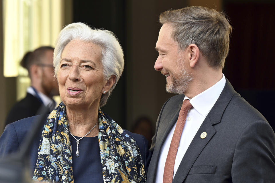 German Finance Minister Christian Lindner, right, welcomes the President of the European Central Bank, Christine Lagarde, left, for a G7 Finance Ministers Meeting at the federal guest house Petersberg, near Bonn, Germany, Thursday, May 19, 2022. (Federico Gambarini/dpa via AP)