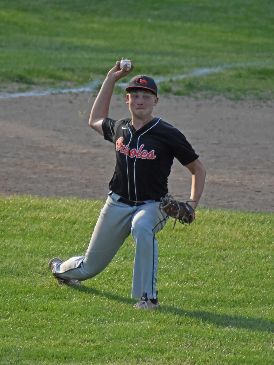 Quincy's Mickey Connin looks to throw out a Union City runner on a slow roller Tuesday