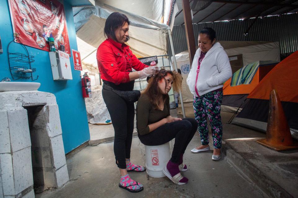 Isaura Nolasco, fair right, is a Guatemalan migrant seeking asylum in the United States. In this photo, she speaks to other migrants at a Tijuana migrant shelter about the possibility of trying to seek asylum at a different point of entry in the U.S./Mexico border on Feb. 09, 2021.