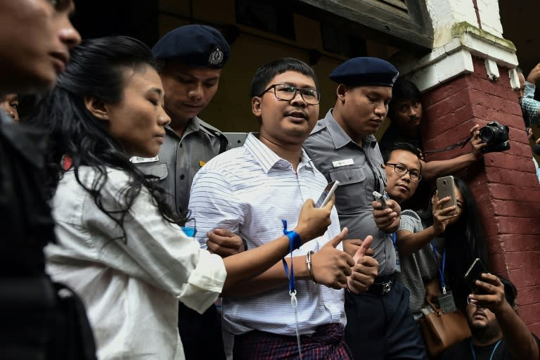 Detained Reuters correspondent Wa Lone (centre) speaks to journalists in Yangon on August 27, 2018