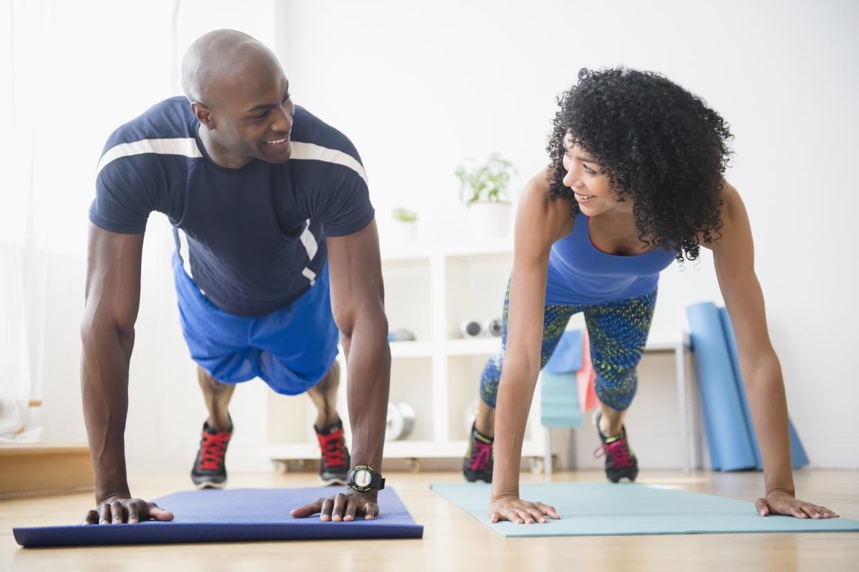 Studies have shown you'll both work harder than you would if you were alone. [Photo: Getty]