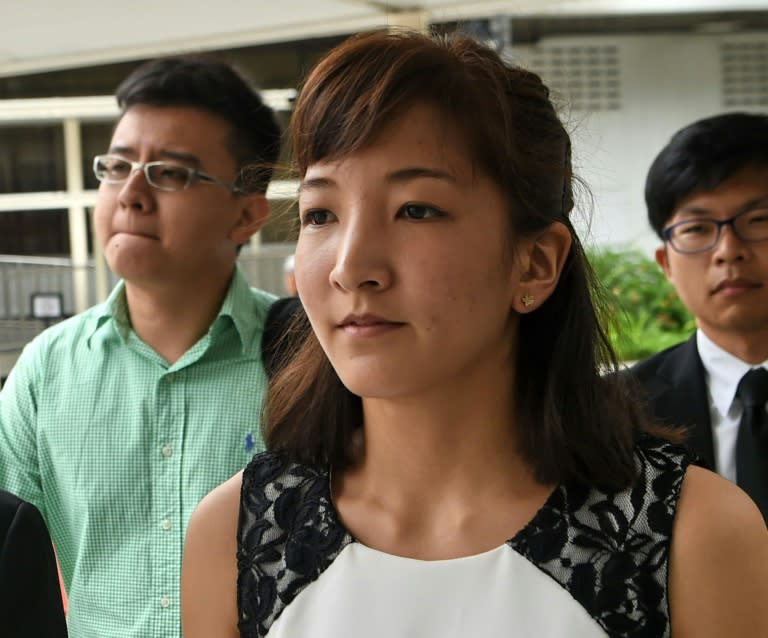 Ai Takagi (centre) has been jailed for 10 months for falling foul of Singapore's colonial-era sedition laws