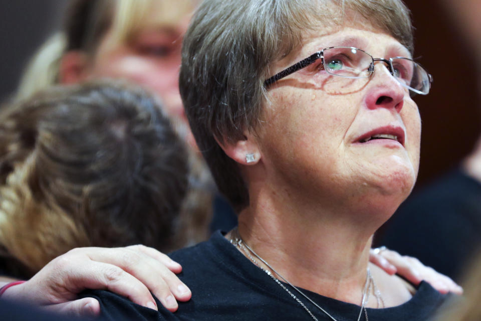 Kristine Young, mother of Ashley Young, reacts at the sentencing of Jared Chance in Kent County Circuit Court, Thursday, Oct. 10, 2019, in Grand Rapids, Mich. Chance, a Michigan man convicted of killing and dismembering Ashley Young has been sentenced to at least 100 years in prison after a judge called his actions "reprehensible and heinous."(Brian Hayes/The Grand Rapids Press via AP)