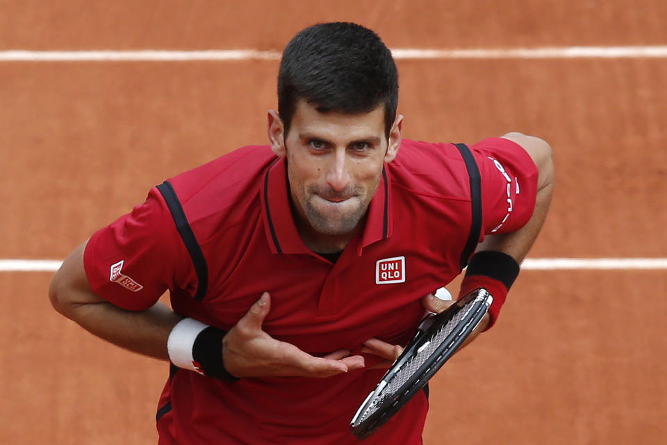 <p>Serbia’s Novak Djokovic acknowledges the cheering crowd after winning his first-round match against Yen-Hsun Lu of Taiwan at the French Open in Paris on May 24, 2016. (Michel Euler/AP) </p>