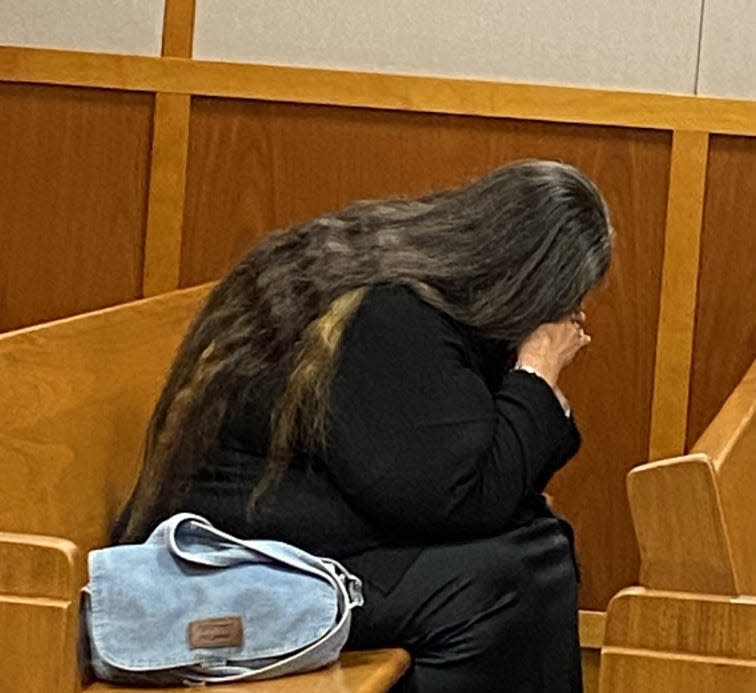 Joshua McClellan's mother, Sara Collins, weeps in court Wednesday.