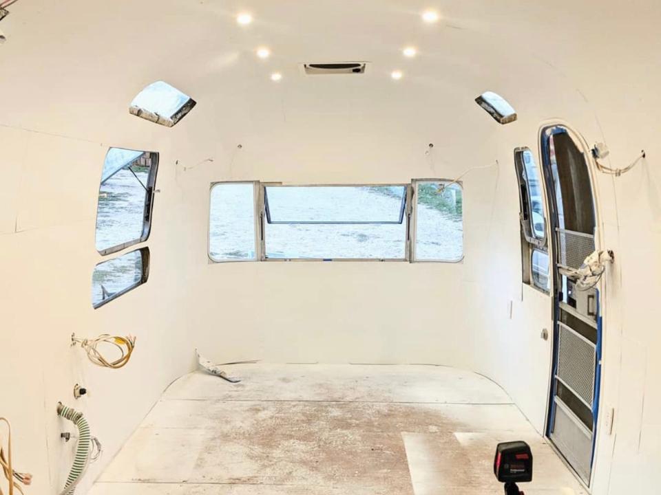 The couple installed interior panels in the Airstream and painted them white to achieve a homely look.