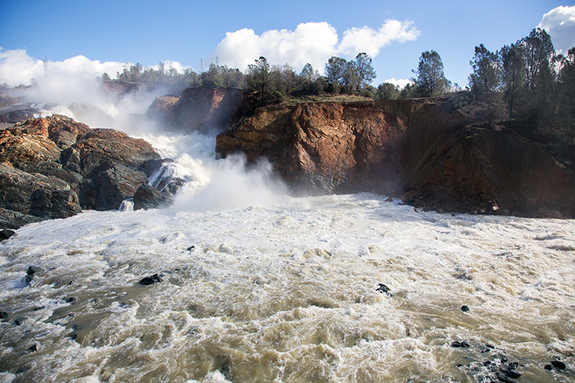 Overflowing water surging out of California's damaged Oroville Dam spillway in 2017.