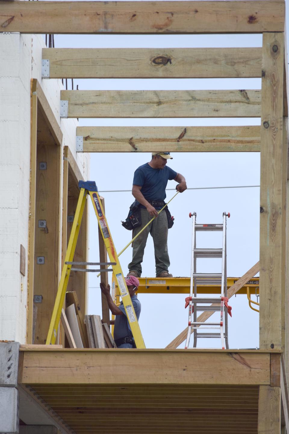 Crews were busy working on home repairs in Mexico Beach on Friday.