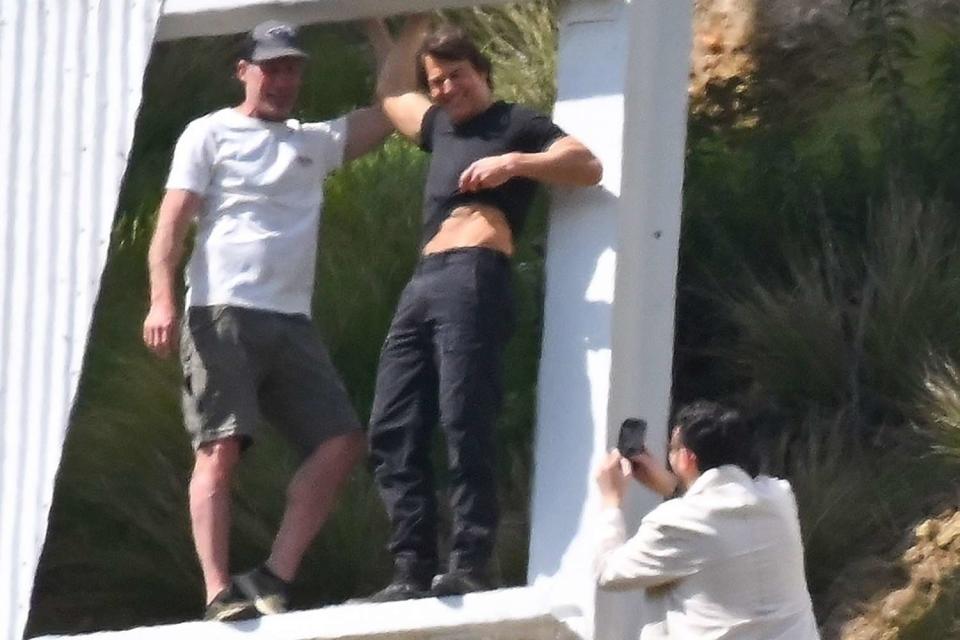 <p>NATO / BACKGRID</p> Tom Cruise and film crew at the Hollywood sign in Los Angeles on March 16, 2024