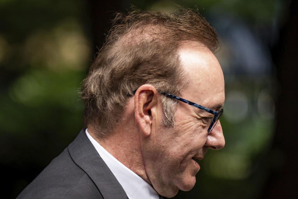 Actor Kevin Spacey looks on as he arrives at Southwark Crown Court, London, where he is charged with three counts of indecent assault, seven counts of sexual assault, one count of causing a person to engage in sexual activity without consent and one count of causing a person to engage in penetrative sexual activity without consent between 2001 and 2005, on Thursday July 13, 2023. (Aaron Chown/PA via AP)