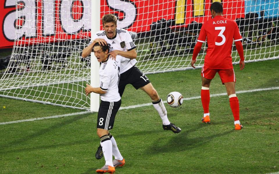 Thomas Mueller of Germany (up) celebrates scoring with Mesut Oezil  - Getty Images