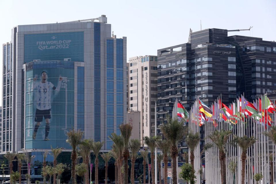 A giant image of Messi is displayed on a building in Doha (Getty)