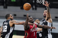 New Orleans Pelicans forward Zion Williamson (1) is fouled by San Antonio Spurs center LaMarcus Aldridge (12) as he tires to score during the second half of an NBA basketball game in San Antonio, Saturday, Feb. 27, 2021. (AP Photo/Eric Gay)