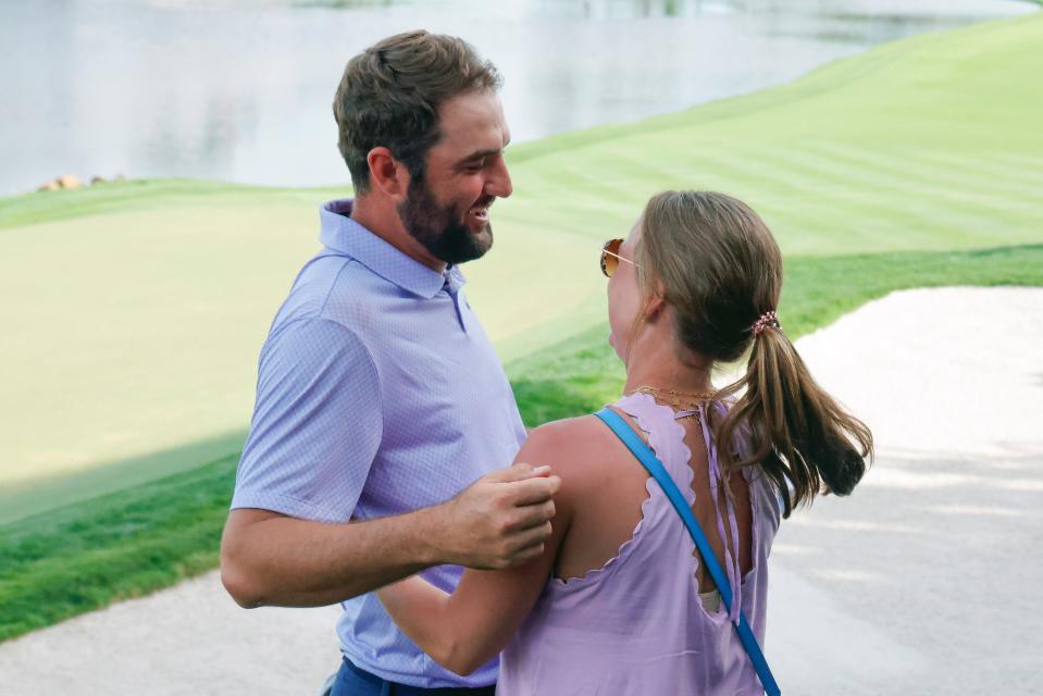 Mar 10, 2024; Orlando, Florida, USA; Scottie Scheffler, left, is met by his wife Meredith Scheffler after winning the Arnold Palmer Invitational golf tournament. Mandatory Credit: Reinhold Matay-USA TODAY Sports ORG XMIT: IMAGN-741524 ORIG FILE ID: 20240310_sjb_mb4_414.JPG