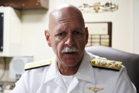 FILE PHOTO:U.S. Pacific Fleet Commander Admiral Scott Swift speaks to reporters aboard the U.S.S. Benfold, a guided-missile destroyer, during a scheduled visit to the Chinese port city of Qingdao, Shandong province, China, August 9, 2016. REUTERS/Paul Carsten