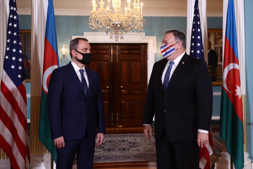 CORRECTS NAME TO AZERBAIJAN FOREIGN MINISTER JEYHAN BAYRAMOV - Secretary of State Mike Pompeo walks out to face reporters with Azerbaijan Foreign Minister Jeyhun Bayramov, prior to holding talks, Friday, Oct. 23, 2020 at the State Department in Washington. (Hannah McKay/Pool via AP)