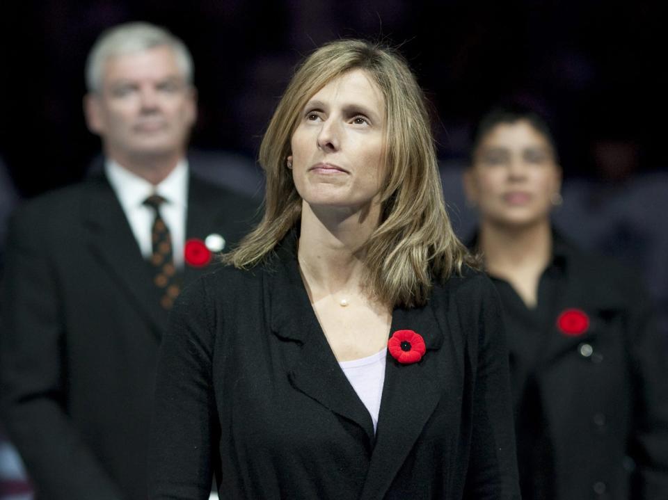 FILE - Cammi Granato stands on center ice after being inducted into the Hockey Hall of Fame before an NHL game between the Toronto Maple Leafs and the Buffalo Sabres in Toronto, Nov. 6, 2010. Granato had never forgotten the young girl she lent her stick and gloves to during one of the former U.S. Olympian’s first hockey camps in Chicago in the late 1990s. It was not until years later when Granato discovered that girl just happened to be Hilary Knight. (AP Photo/The Canadian Press, Chris Young, File)