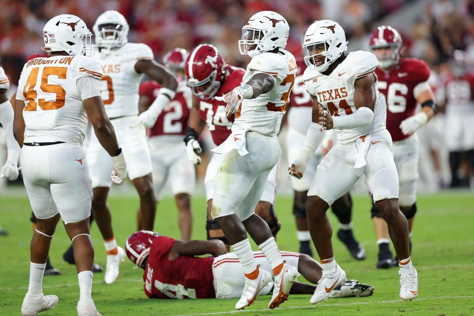 Texas linebacker David Gbenda celebrates after sacking Alabama quarterback Jalen Milroe during the second quarter at Bryant-Denny Stadium.