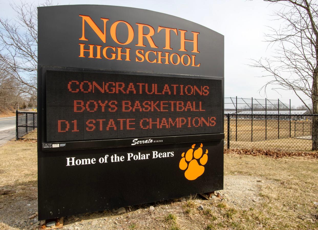 The North High School sign congratulates the state championship boys' basketball team.