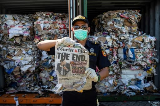 Hundreds of shipping containers, such as this one sent from Australia, have been found to be filled with household trash and hazardous waste