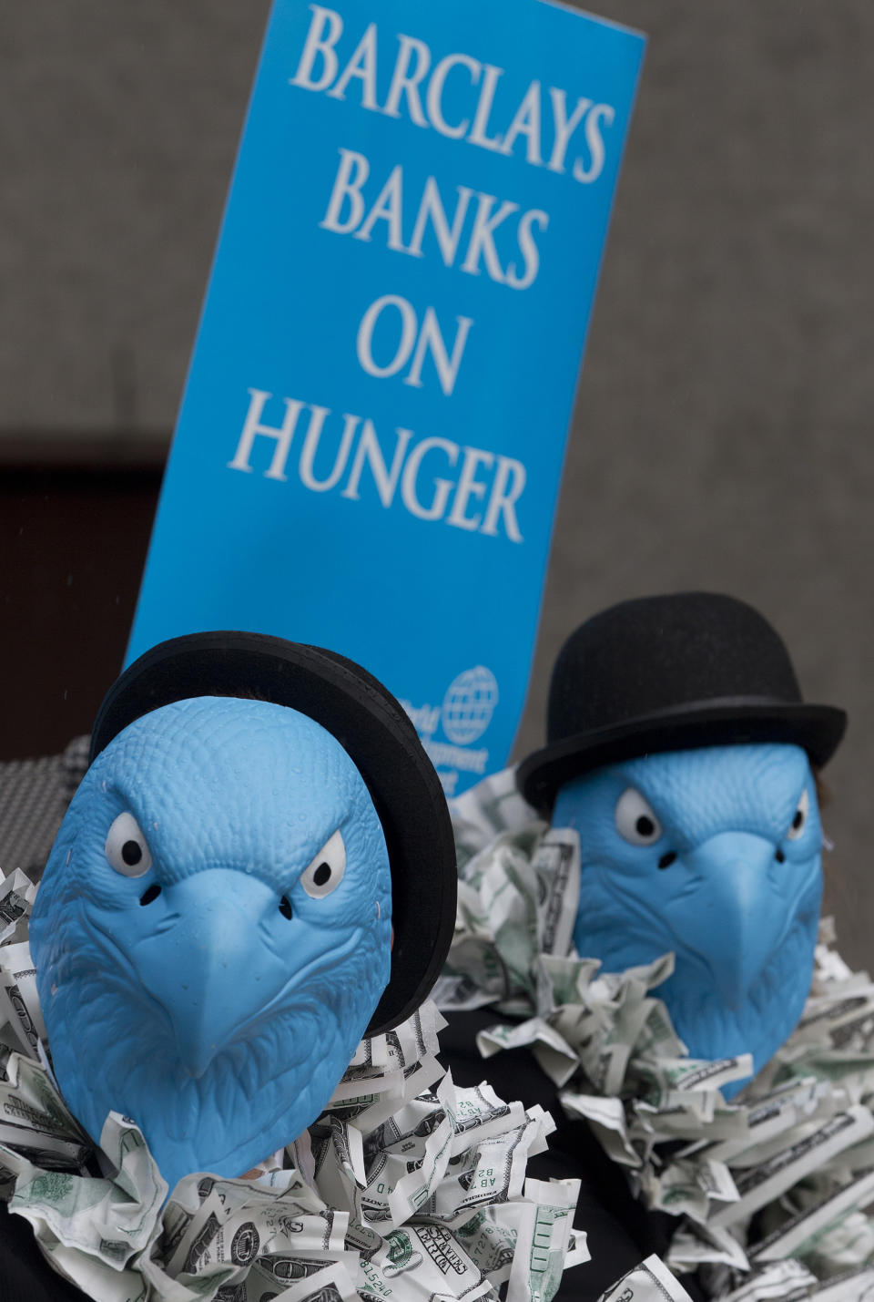 Demonstrators protesting about Barclays Bank and its world wide operations outside the Royal Festival Hall where the Barclays Bank Annual General Meeting for shareholders is being held in London, Friday, April 27, 2012. The protesters wear blue eagle masks which is the Barclay Bank company logo. Barclays PLC reported a 25 percent gain in first-quarter net profit on Thursday, beating market forecasts with strong performances in its retail and business banking, and wealth and investment management divisions. For the three months ending March 31, Barclays reported an adjusted profit after tax of 1.87 billion pounds ($3 billion) after taxes, compared to 1.5 billion pounds a year earlier. Income rose by 5 percent to 8.14 billion pounds.(AP Photo/Alastair Grant)