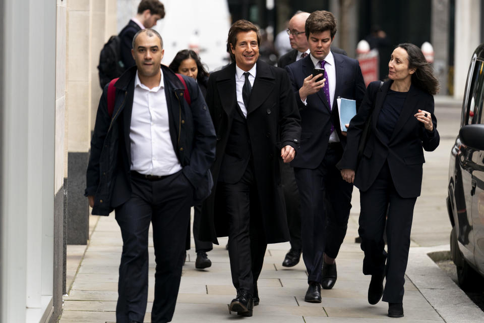 Attorney David Sherborne, second from left, at the Rolls Buildings, central London, Wednesday March 20, 2024. Britain's Prince Harry's lawyer says the cover-up of unlawful information gathering at British tabloids owned by Rupert Murdoch went all the way to the top. Attorney David Sherborne said Wednesday in the High Court that Murdoch was among the executives at News Group Newspapers aware of skullduggery carried out by journalists and private investigators working for the now-defunct News of the World, and The Sun. (Jordan Pettitt/PA via AP)