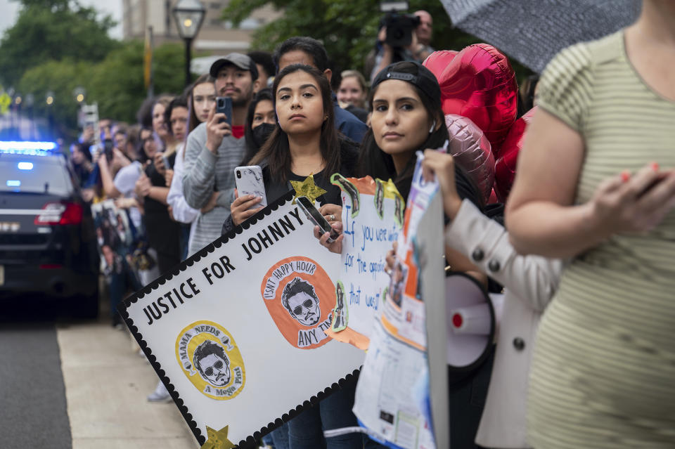 Supporters of actor Johnny Depp wait outside of Fairfax County Courthouse for his arrival as a jury is scheduled to hear closing arguments in Depp's high-profile libel lawsuit against ex-wife Amber Heard in Fairfax, Va., on Friday, May 27, 2022.(AP Photo/Craig Hudson)