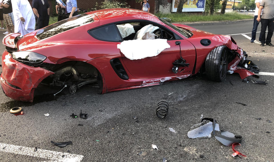 The red Porschue after the collision. (SWNS)