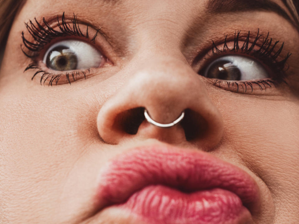 closeup of a nose piercing