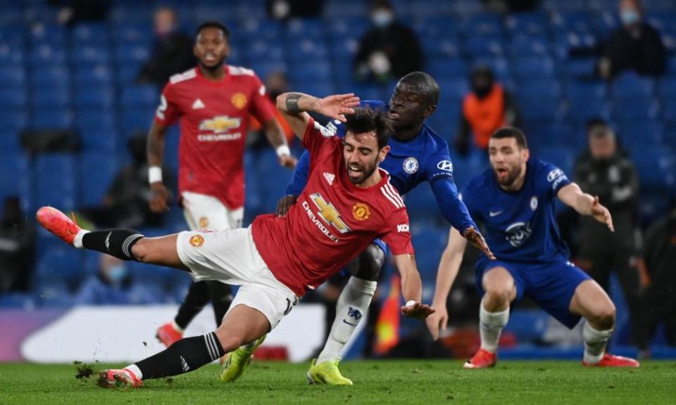 Manchester United’s Bruno Fernandes collides with N’Golo Kante during the draw against Chelsea.