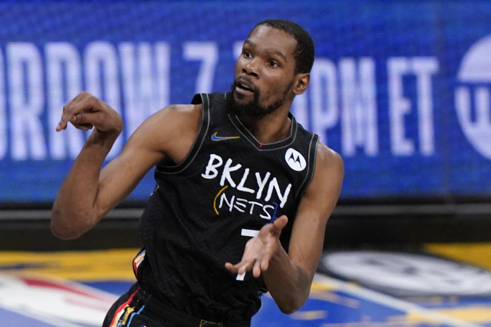 Brooklyn Nets forward Kevin Durant (7) watches as he sinks a 3-point shot during the fourth quarter of Game 5 of a second-round NBA basketball playoff series against the Milwaukee Bucks, Tuesday, June 15, 2021, in New York. (AP Photo/Kathy Willens)