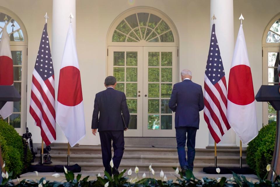 President Joe Biden and Japanese Prime Minister Yoshihide Suga leave after a news conference in the Rose Garden of the White House, Friday, April 16, 2021, in Washington.