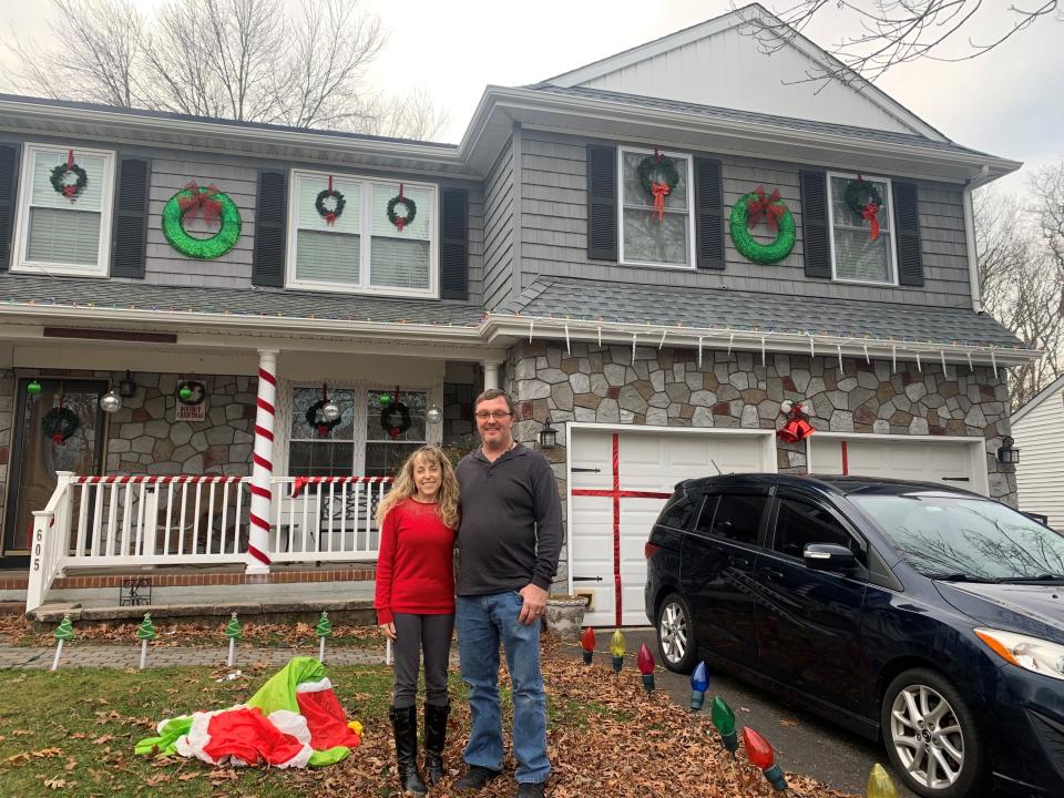 Becky and Bob Kolas in front of their renovated Toms River home