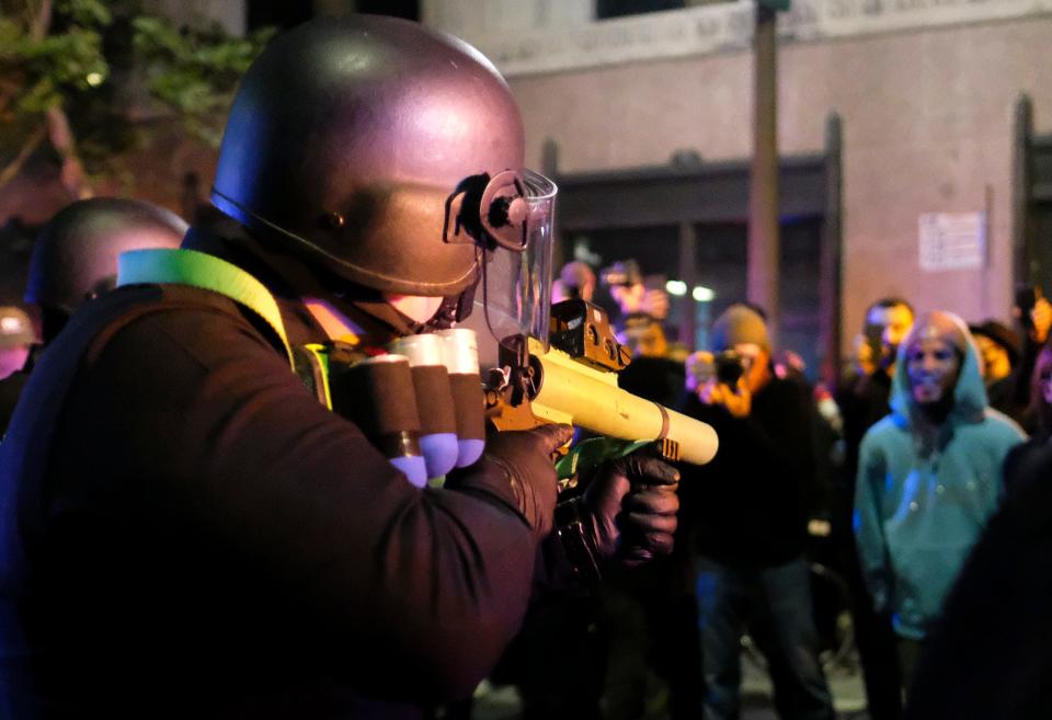 A police officer prepares to fire rubber bullets during a protest over the death of George Floyd on May 29, 2020, in Los Angeles.