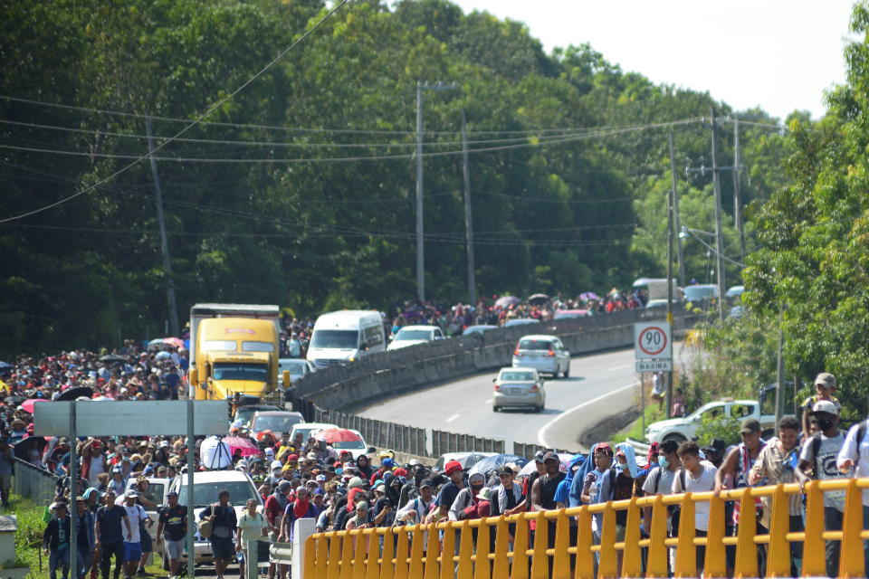 Migrants from Central America walk on a highway in a caravan headed to the Mexican capital to apply for asylum and refugee status, in Tapachula municipality, in Chiapas state, Mexico October 24, 2021. REUTERS/Jacob Garcia
