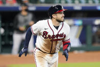 Atlanta Braves' Travis d'Arnaud watches the ball he hit for a three-run home run during the seventh inning in Game 1 of a baseball National League against the Miami Marlins Division Series Tuesday, Oct. 6, 2020, in Houston. (AP Photo/Eric Gay)