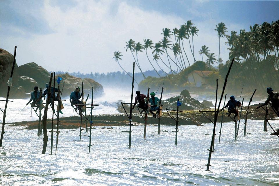 Fishermen are suspended above the water at Xiapu bay.
