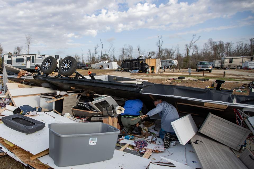 Kevin Keene and his brother, Thad Brown sort through rubble and debris to find KeeneÕs belongings after a tornado destroyed his RV in Marianna, Florida on Tuesday, Jan. 9, 2024.