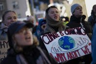 Demonstrators shout slogans during a demonstration against the World Economic Forum in Davos, Switzerland, Sunday, Jan. 14, 2024. The annual meeting of the World Economic Forum is taking place in Davos from Jan. 15 until Jan. 19, 2024.(AP Photo/Markus Schreiber)