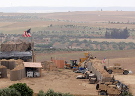 FILE PHOTO: U.S. forces set up a new base in Manbij, Syria May 8, 2018. REUTERS/Rodi Said/File Photo