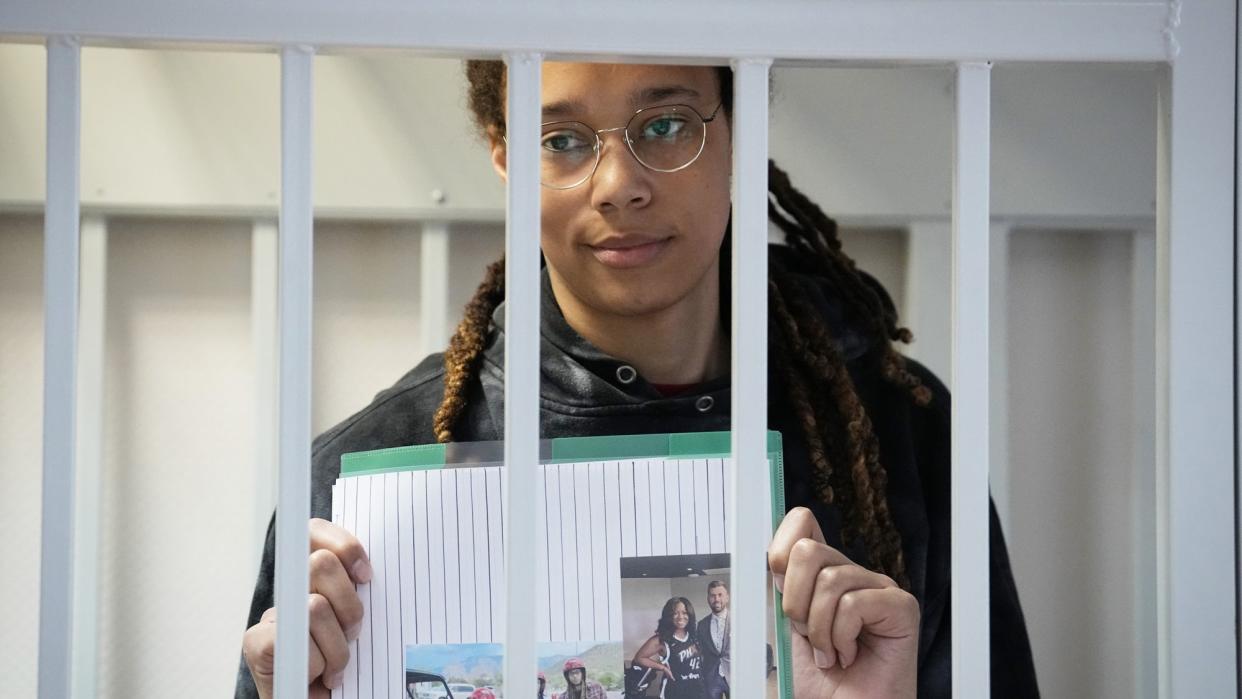 Star and two-time Olympic gold medalist Brittney Griner holds images standing in a cage at a court room prior to a hearing, in Khimki just outside Moscow, Russia, . American basketball star Brittney Griner has returned to a Russian courtroom for her drawn-out trial on drug charges that could bring her 10 years in prison if convicted Russia Griner, Moscow, Russian Federation - 26 Jul 2022