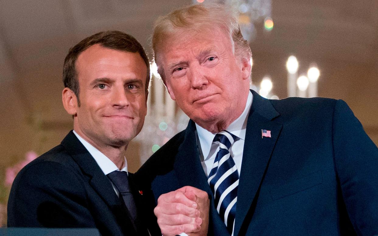 Pour l'homme: Donald Trump preferred to do business with alpha males such as Emmanuel Macron, rather than 'losers' - AP/Andrew Harnik