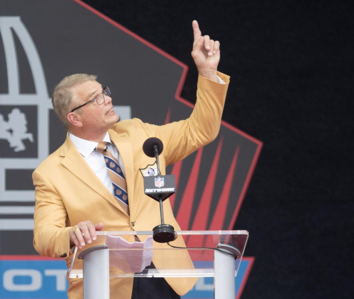 Joe Klecko points up and says he has one more hall of fame to make during his Pro Football Hall of Fame Enshrinement speech, Saturday, Aug. 5, 2023, in Canton.